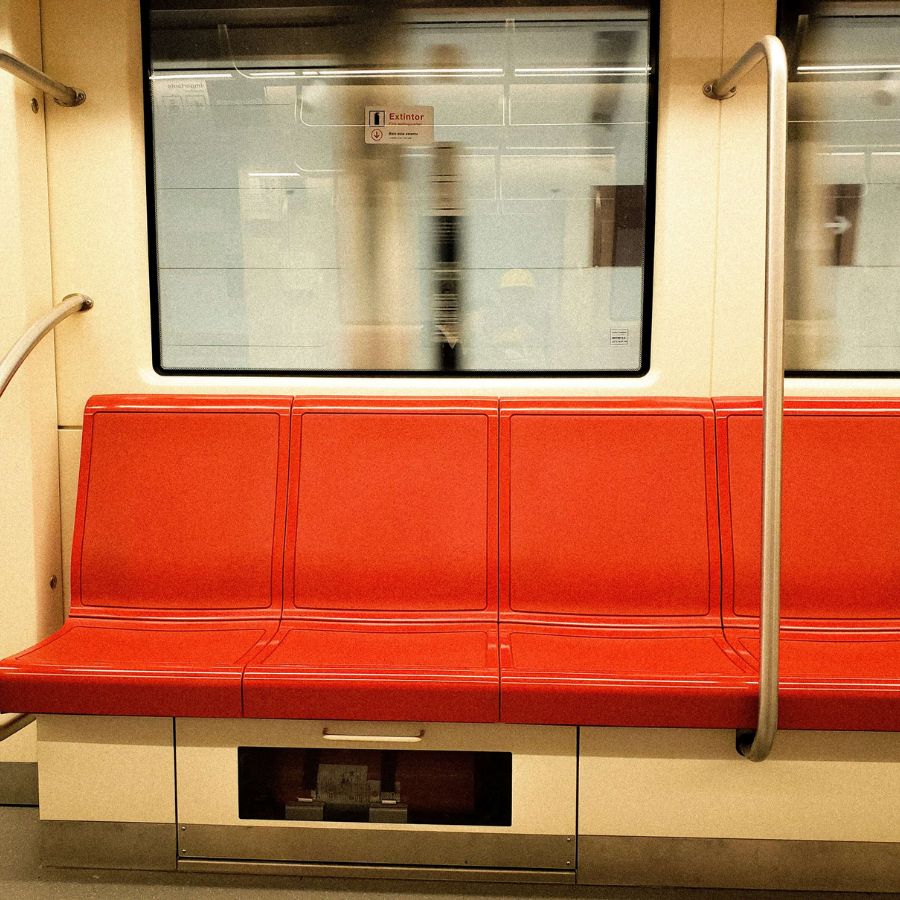 Red seats in a subway car